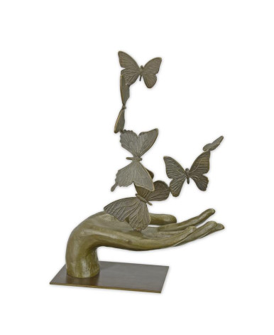 Bronzen beeld van een hand die vlinders loslaat