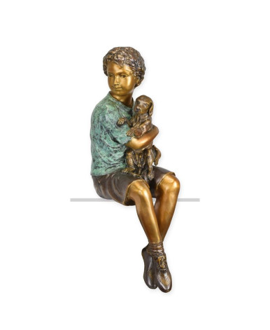 Bronzen beeld van jongen met zijn hond